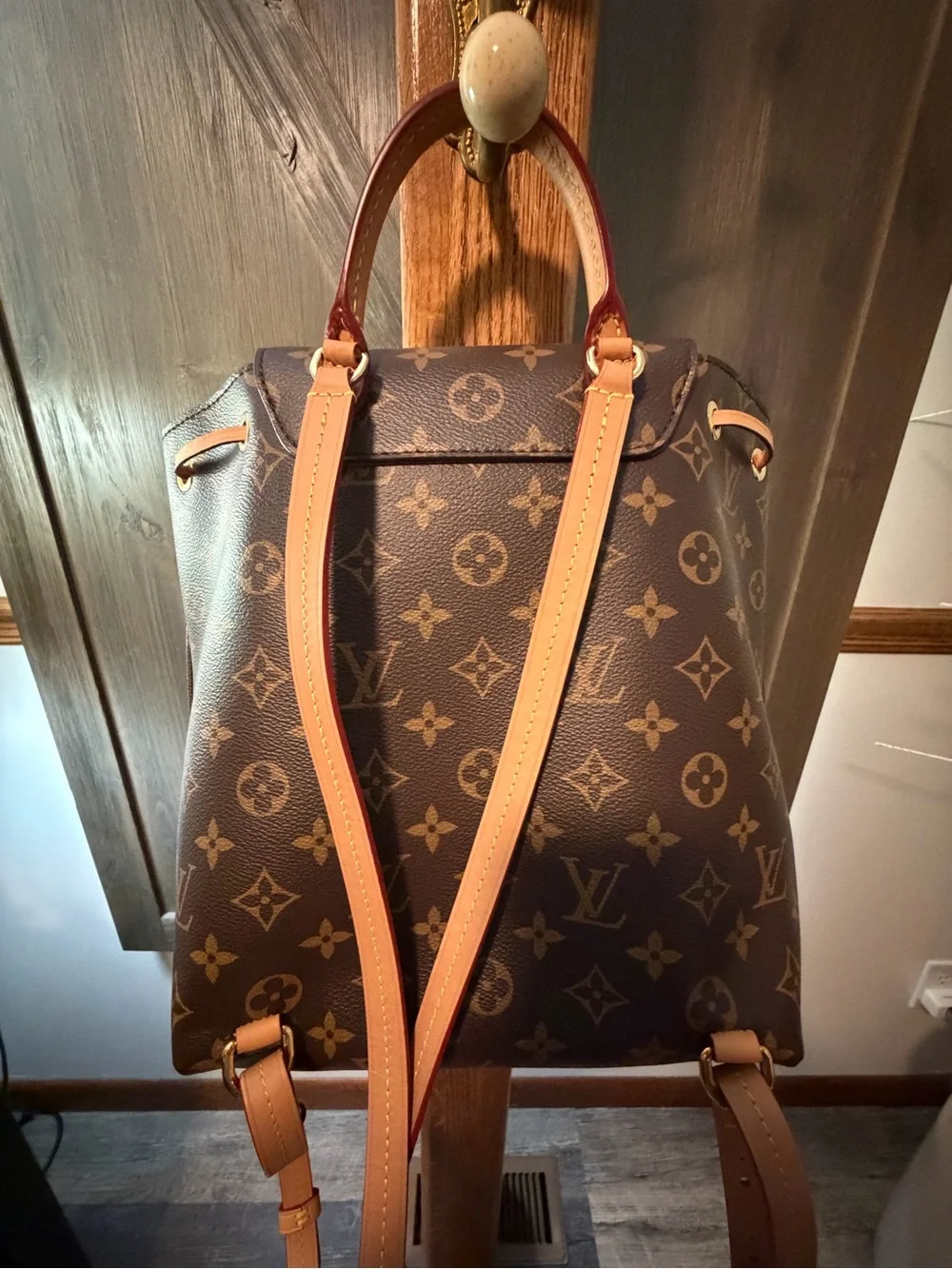Louis Vuitton Monogram Canvas Backpack with Tan Leather Trim and Pink Charm